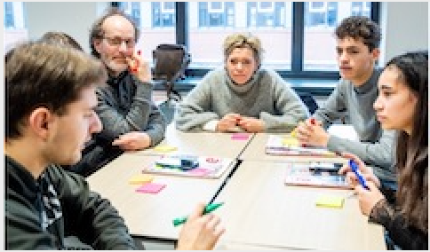 Students and instructor engaging in discussion.