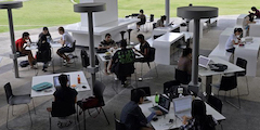 students working outside at tables